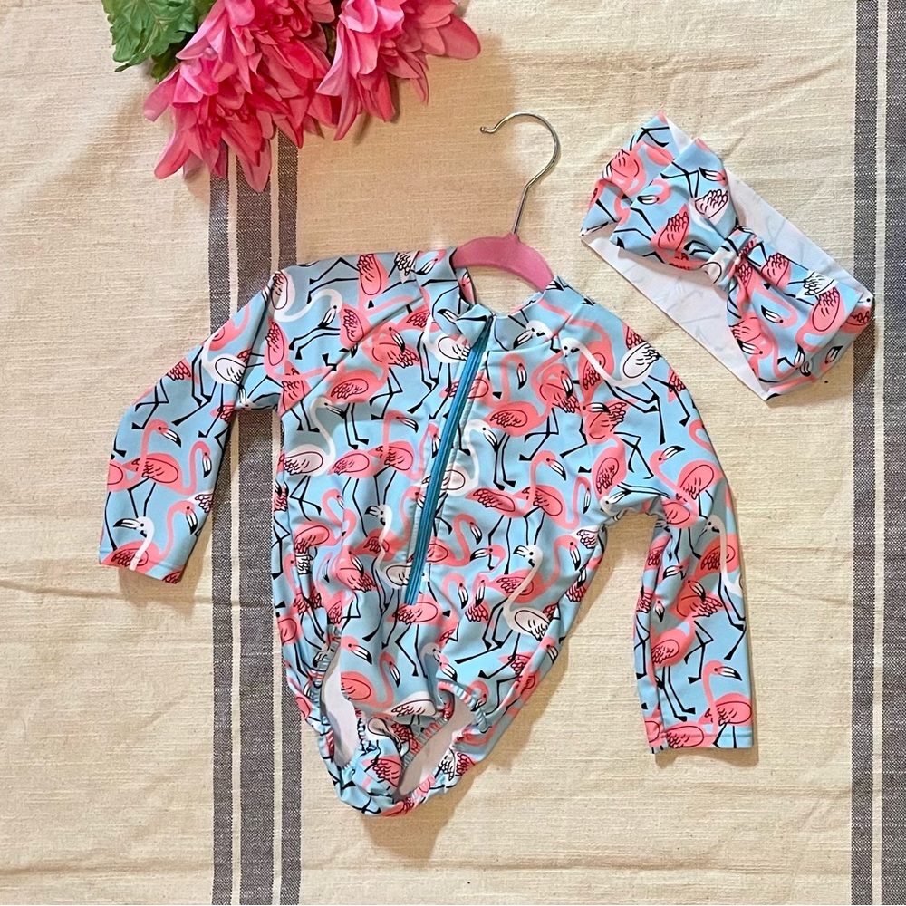 Little girl flamingo swim suit with matching bow; size 1/2 year